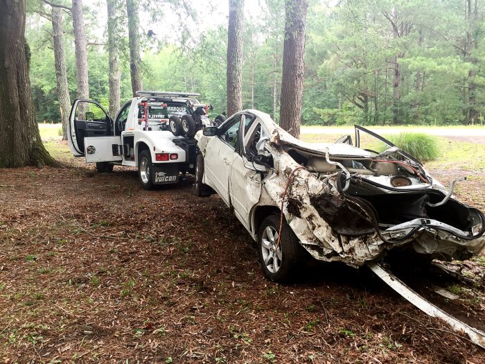 A white car at the scene of an accident.
