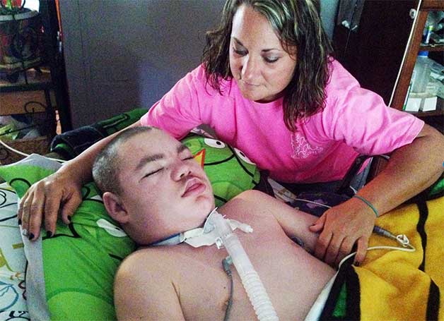 Taylor Goode suffers from a seizure disorder, and doctors have sent him home as a hospice patient. His mother, Jennifer Potts, is interested in experimentally treating her son with cannabis oil, derived from marijuana, to see if it will improve his condition. A Mississippi law passed this year has enabled the creation of cannabis oil as a form of treatment for patients with seizure disorders. (Photo by LaReeca Rucker)