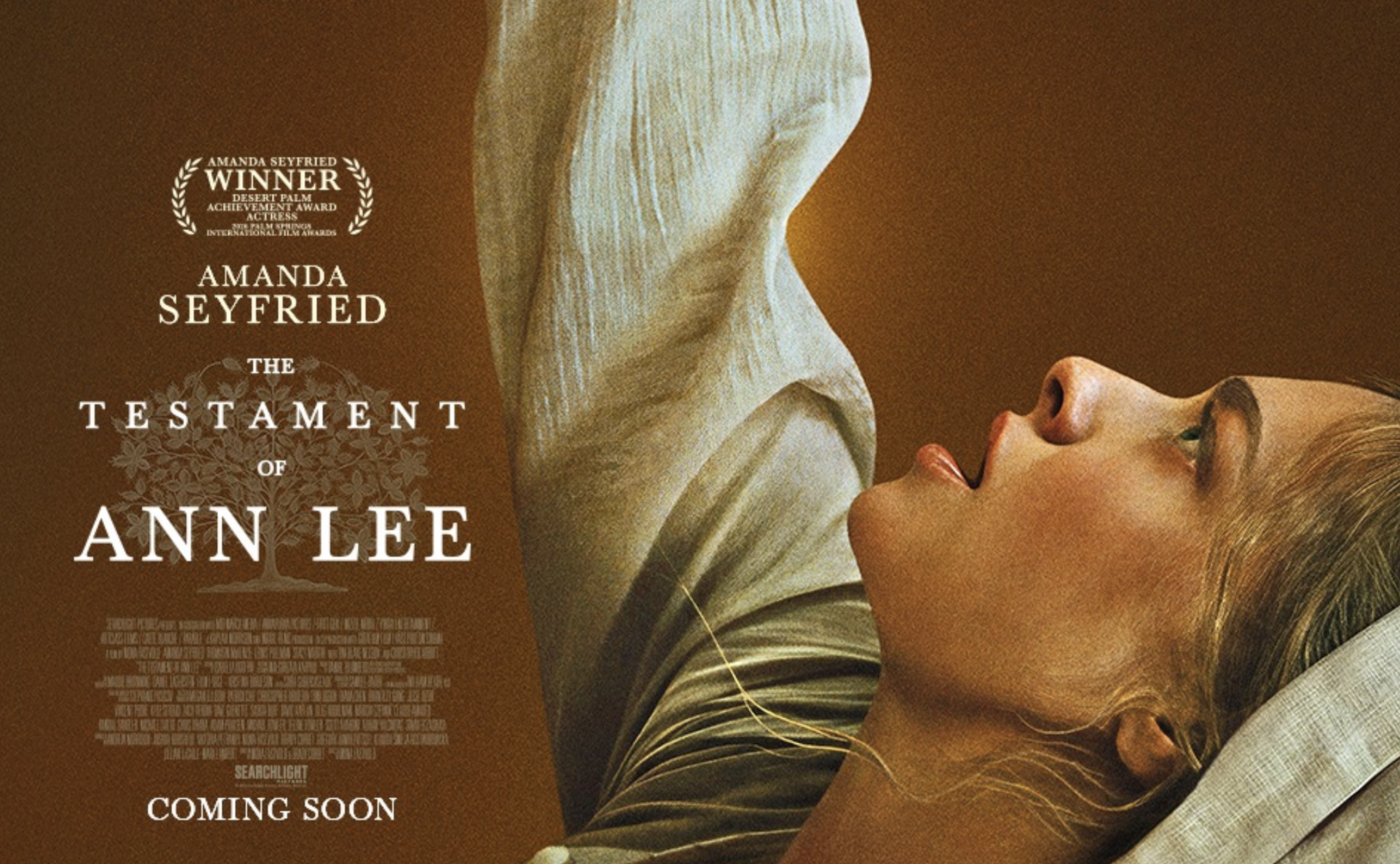 The movie poster for "The Testament of Ann Lee." It features a picture of the actress who plays Ann Lee in costume reaching above her as part of dance.