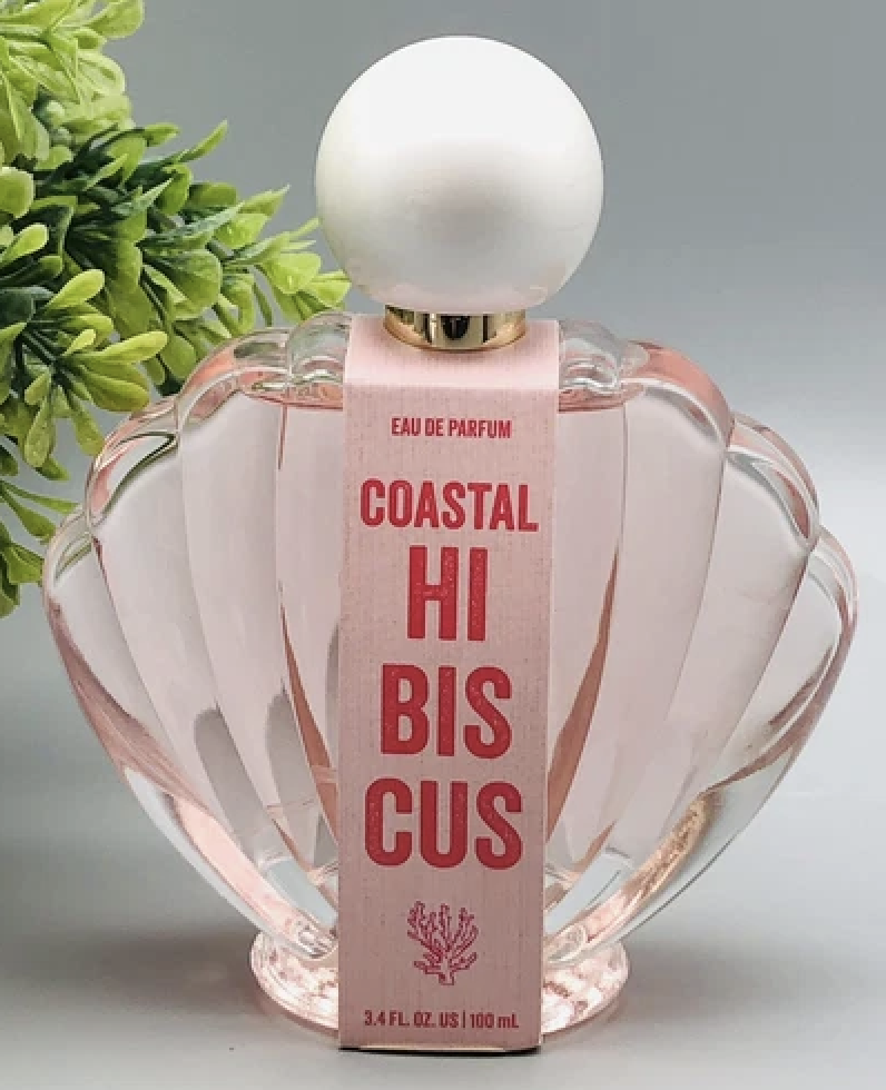 A picture of the pink shell and pearl bottle of Coastal Hibiscus perfume from the internet.