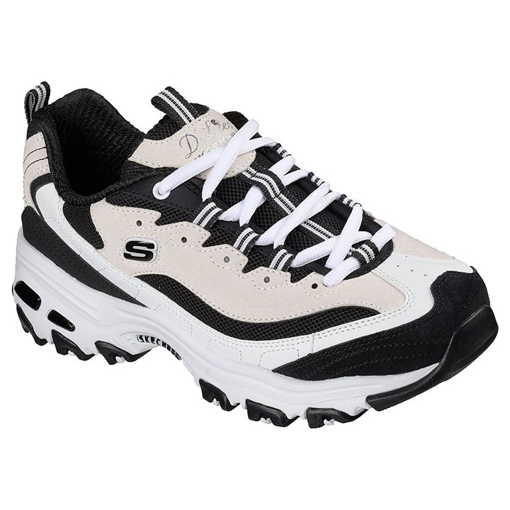 A black and white pair of Sketchers shoes.